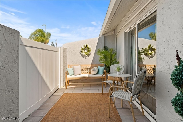 view of patio featuring fence