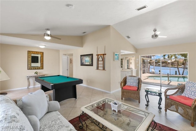 recreation room featuring light tile patterned floors, vaulted ceiling, visible vents, and a ceiling fan