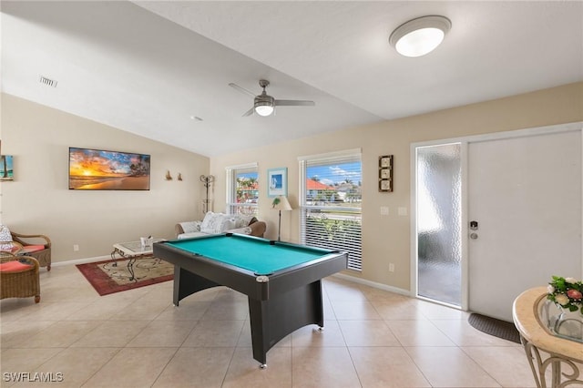 rec room with lofted ceiling, light tile patterned floors, baseboards, and a ceiling fan