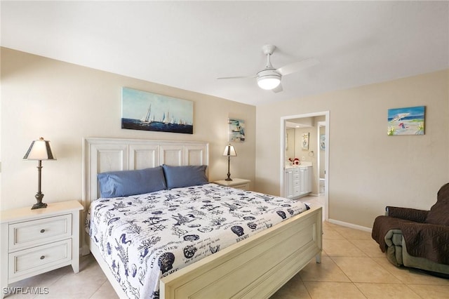 bedroom featuring light tile patterned floors, ceiling fan, ensuite bathroom, and baseboards