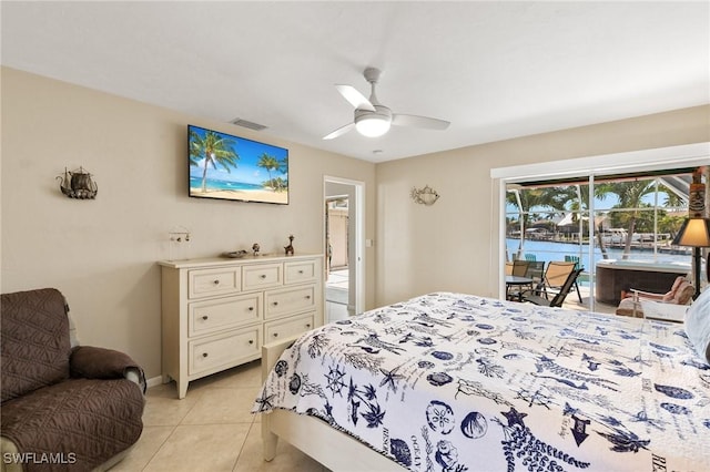 bedroom featuring access to exterior, light tile patterned floors, visible vents, a ceiling fan, and baseboards