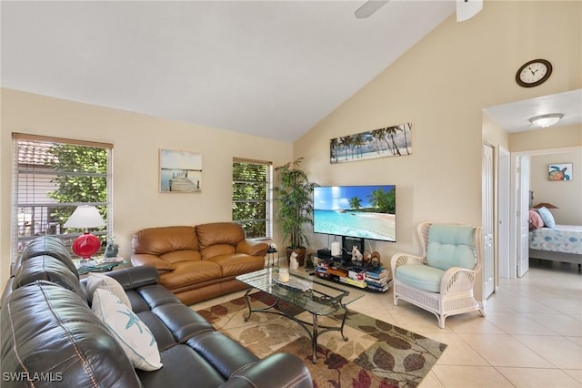 living room with light tile patterned floors, high vaulted ceiling, and a healthy amount of sunlight