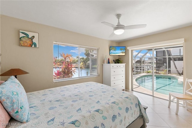 bedroom with access to exterior, ceiling fan, and light tile patterned floors