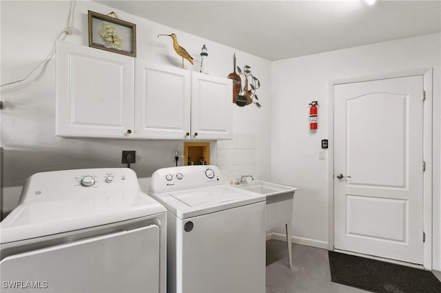 1145 Shenandoah Ct, Marco Island, FL 34145 - laundry area with cabinet space, washer and clothes dryer, and baseboards