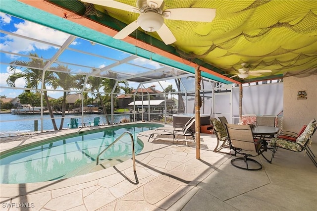 exterior space with a hot tub, glass enclosure, ceiling fan, and a patio