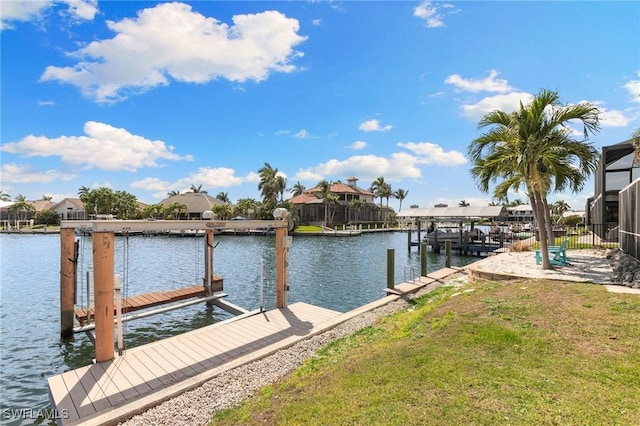 dock area with a water view and boat lift