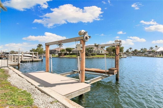 dock area featuring a water view and boat lift