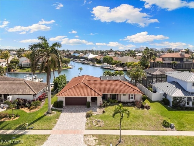 birds eye view of property featuring a water view and a residential view