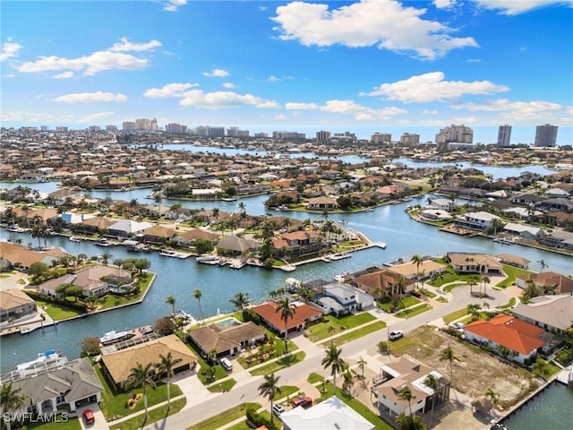 aerial view featuring a residential view, a water view, and a city view