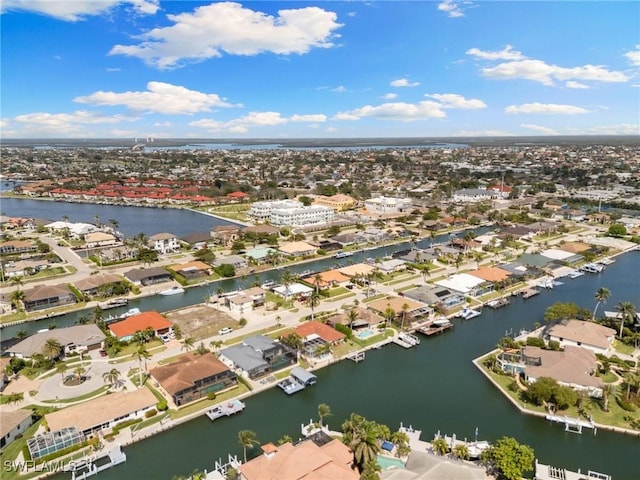 bird's eye view with a residential view and a water view