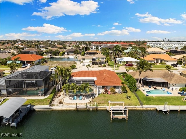 bird's eye view with a water view and a residential view