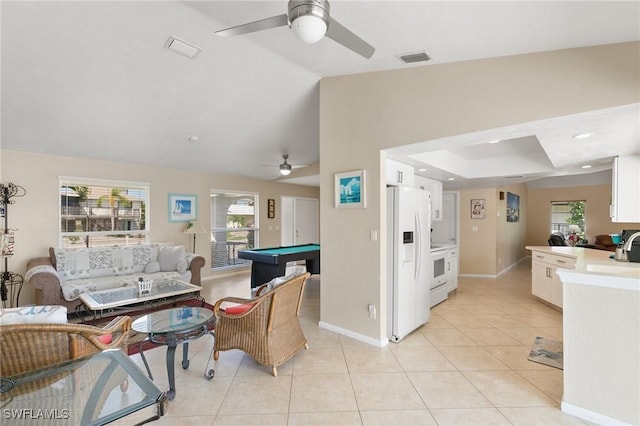 living area featuring lofted ceiling, visible vents, billiards, and light tile patterned floors