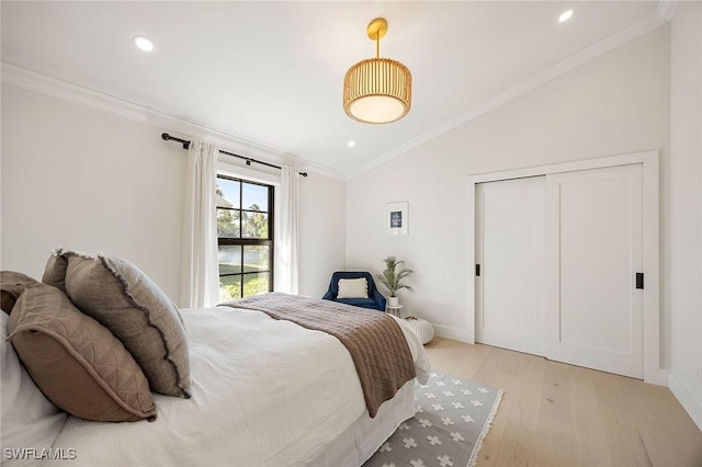 bedroom featuring lofted ceiling, ornamental molding, recessed lighting, and light wood-style floors