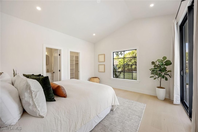 bedroom with recessed lighting, vaulted ceiling, ensuite bath, and light wood finished floors