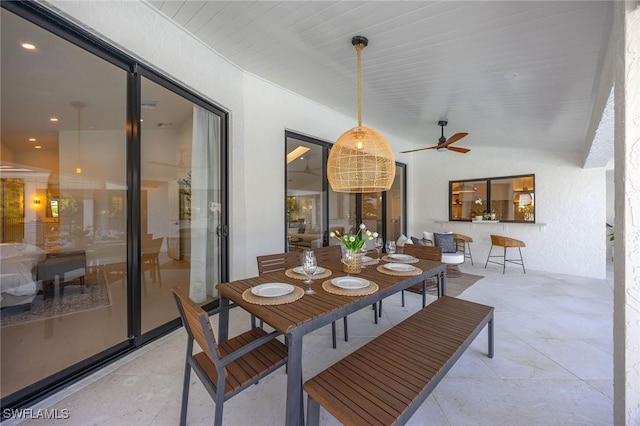 dining area with vaulted ceiling and ceiling fan