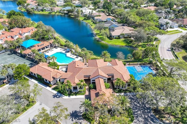 birds eye view of property with a residential view and a water view