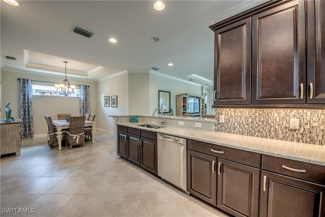 kitchen featuring a tray ceiling, visible vents, stainless steel dishwasher, a sink, and dark brown cabinets