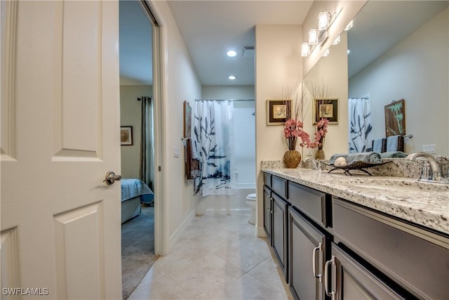 full bath with toilet, a sink, tile patterned floors, shower / tub combo with curtain, and double vanity