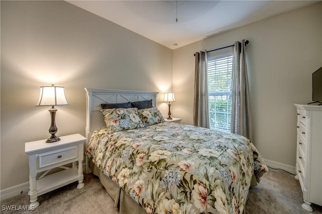 bedroom with carpet and baseboards