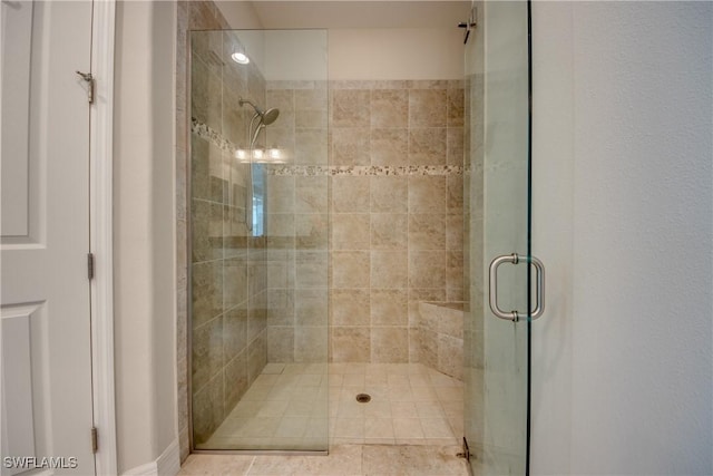 full bath with a shower stall