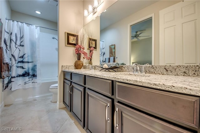 full bathroom featuring double vanity, toilet, shower / tub combo, a sink, and tile patterned flooring