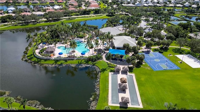 drone / aerial view with a residential view and a water view