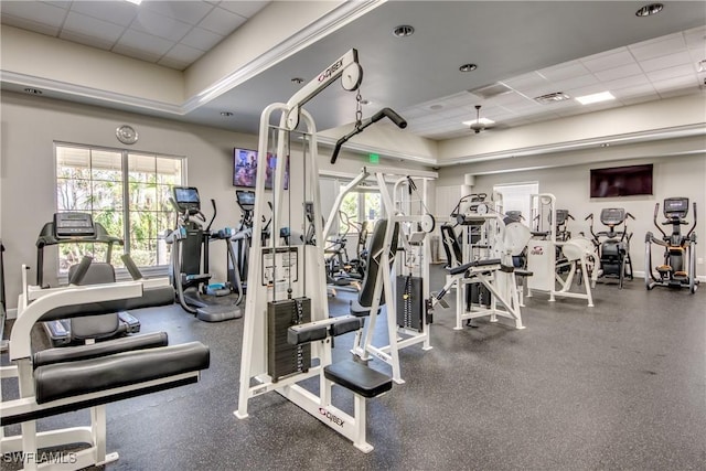 exercise room with a drop ceiling and visible vents