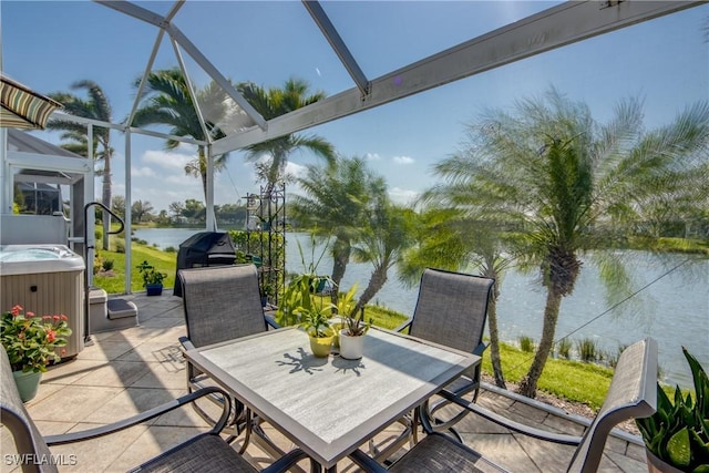 view of patio / terrace featuring a water view, a hot tub, a lanai, and outdoor dining area