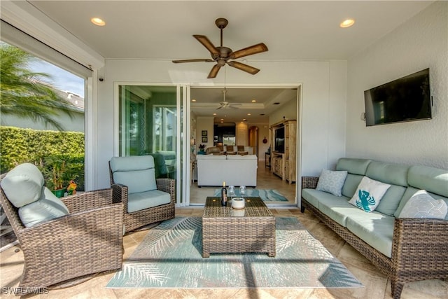 view of patio with ceiling fan and an outdoor living space