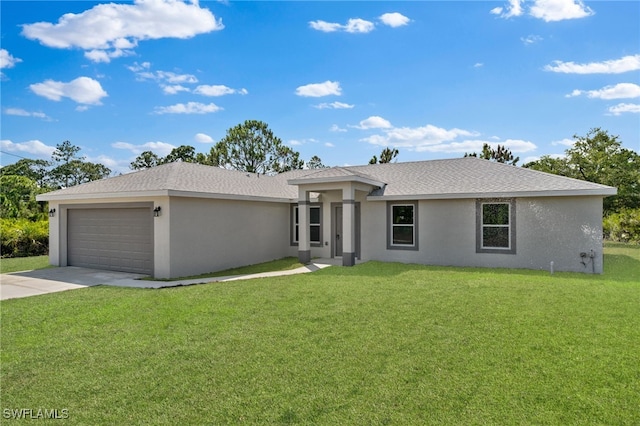 view of front facade featuring an attached garage, concrete driveway, a front yard, and stucco siding