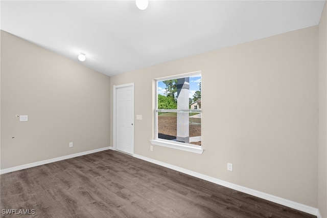 unfurnished room featuring dark wood finished floors and baseboards