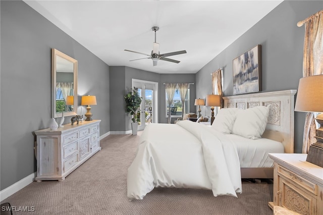 bedroom with access to outside, baseboards, a ceiling fan, and light colored carpet