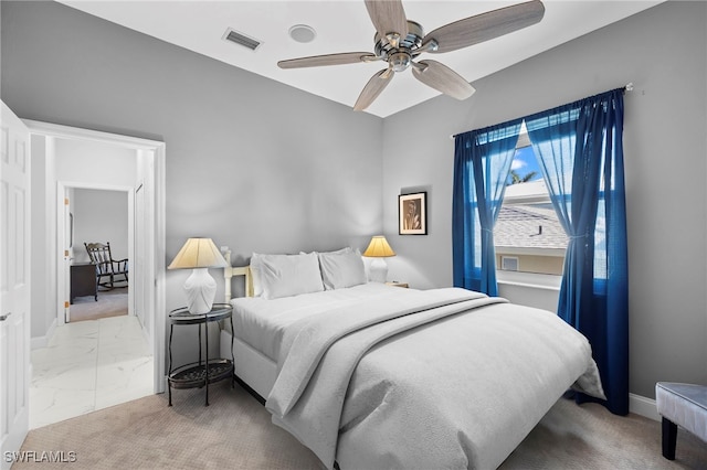 bedroom with marble finish floor, visible vents, ceiling fan, and baseboards