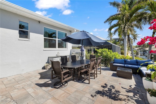 view of patio featuring outdoor dining area and outdoor lounge area