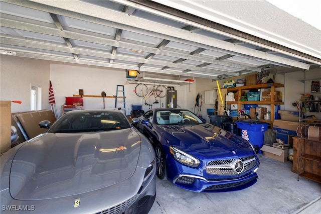 garage with water heater and a garage door opener