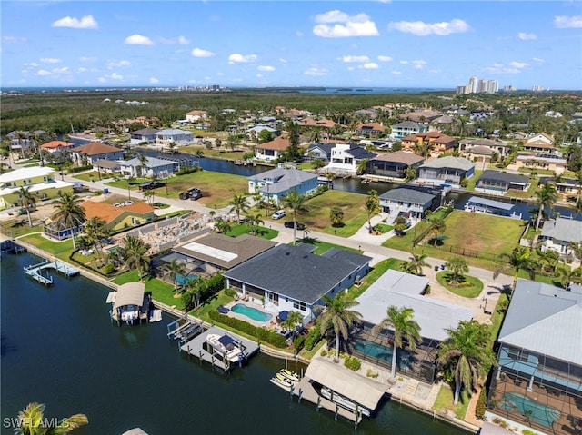 bird's eye view featuring a water view and a residential view