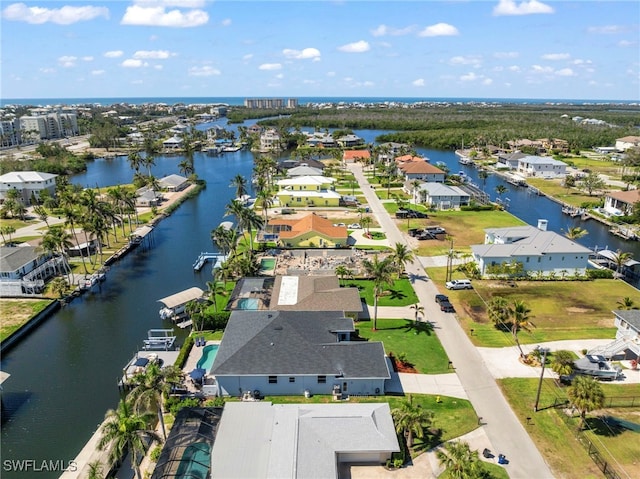 aerial view with a water view and a residential view