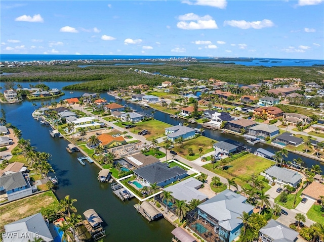 birds eye view of property featuring a residential view and a water view