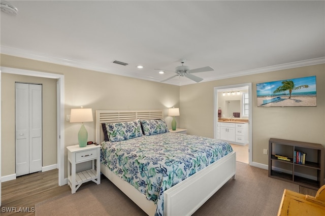 bedroom featuring connected bathroom, visible vents, crown molding, and baseboards