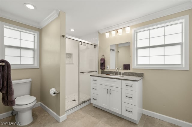 full bathroom featuring toilet, vanity, baseboards, a stall shower, and crown molding