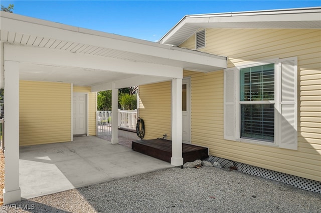 view of patio / terrace featuring a carport