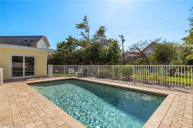 view of swimming pool featuring a fenced in pool, fence, and a patio