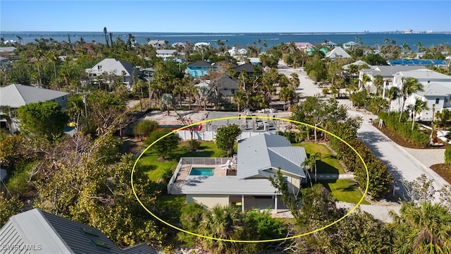 aerial view with a water view and a residential view