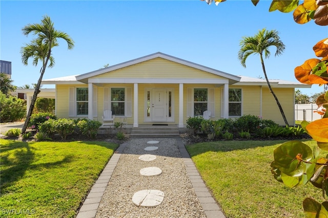 view of front of home featuring a porch and a front yard