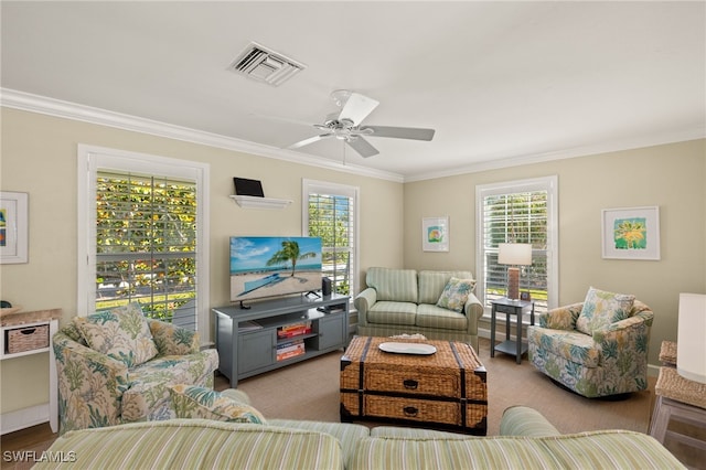 living room featuring crown molding, visible vents, and plenty of natural light