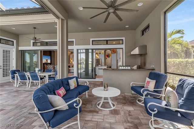 interior space featuring a healthy amount of sunlight and ceiling fan