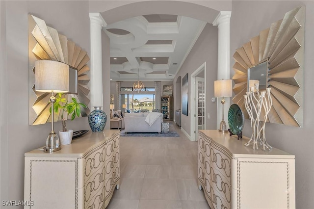 hallway featuring ornate columns, crown molding, coffered ceiling, and beam ceiling