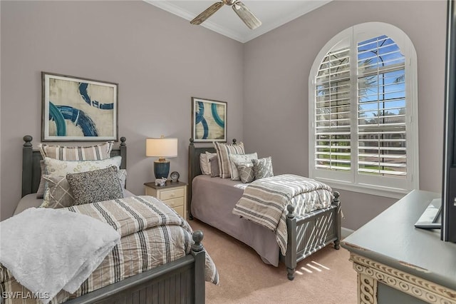 bedroom featuring carpet, a ceiling fan, and crown molding