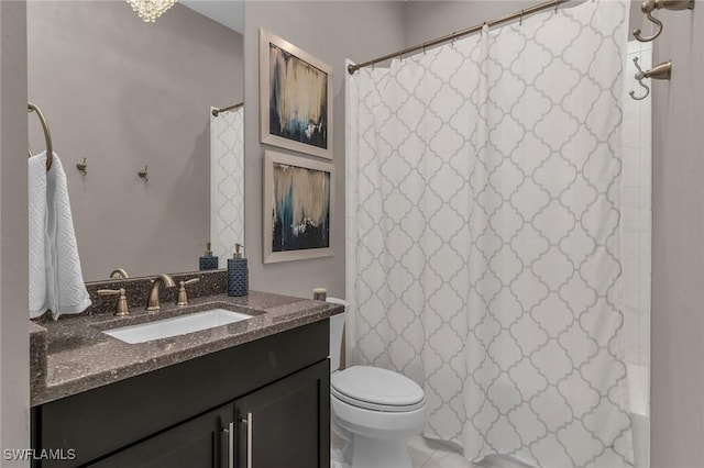 bathroom featuring a shower with curtain, vanity, and toilet