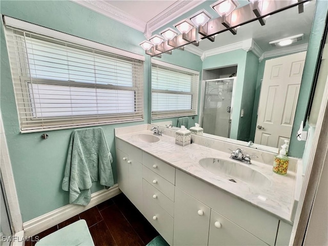 full bathroom with crown molding, a sink, a shower stall, and wood finished floors